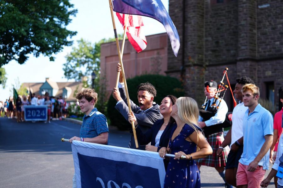 SGA co-presidents Sarah Jiang 22 and Noah Toole 22 lead sixth formers to the CFTA for Convocation. Photo by Erick Sun 24