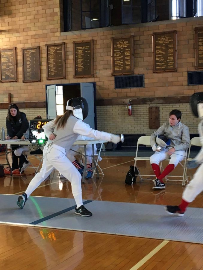 Ruthanne Sander 22 lines up in fencing match. 