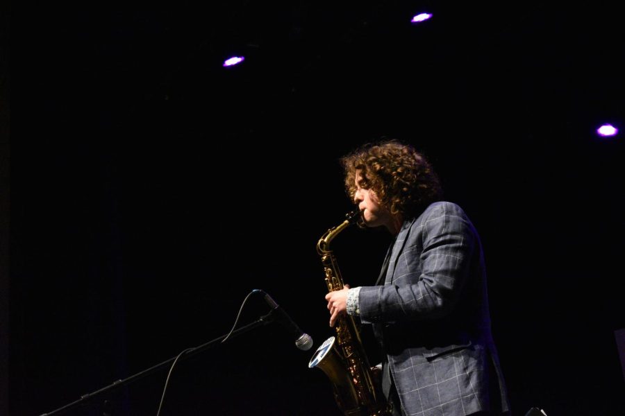 Wesley Connelly ‘22 solos on his saxophone during the winter Jazz Ensemble concert. 