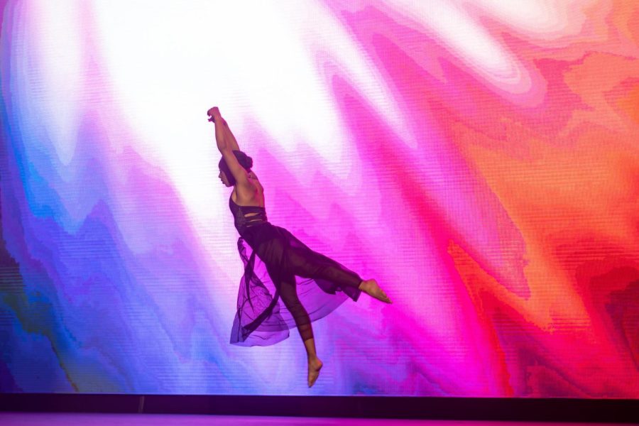 Adele Harris 22 leaps mid air during a performance. Photo Courtesy of Hill Snapshots. 