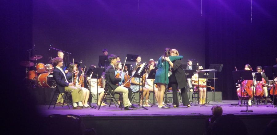Sarah Jiang 22 and Margaret Neiswender embrace after tribute to Neiswender. 