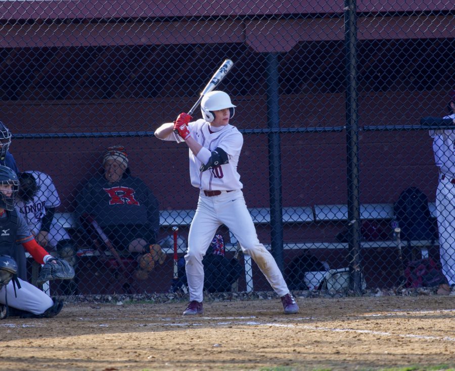 Will Reger ’23 bats for his team prior to attending Hill.