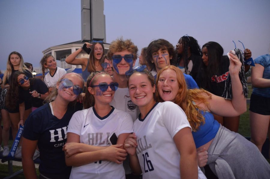 Blue crew cheers on hill boys soccer for their blue light game.