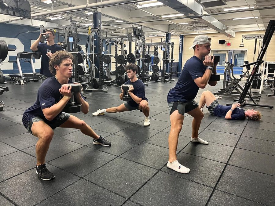 Hill boys ice hockey players work out at strength and conditioning.