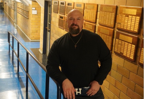 Kevin Tkachuk models the most recent fashion trend to hit campus: the turtleneck and chain.