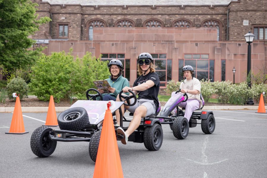 Students drive peddle cars with goggles that simulate alcohol impairment. This excercise took place during a larger event held by SAMH that raised awareness of substance abuse. 