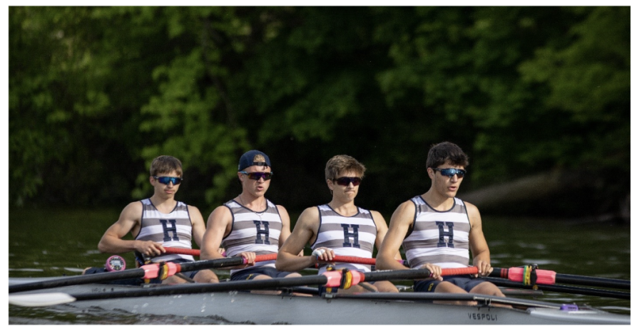 Nate Whittemore 23 cruises down the river in the boat with his teammates