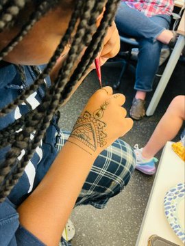 Students receiving henna in honor for AAPI Heritage Month