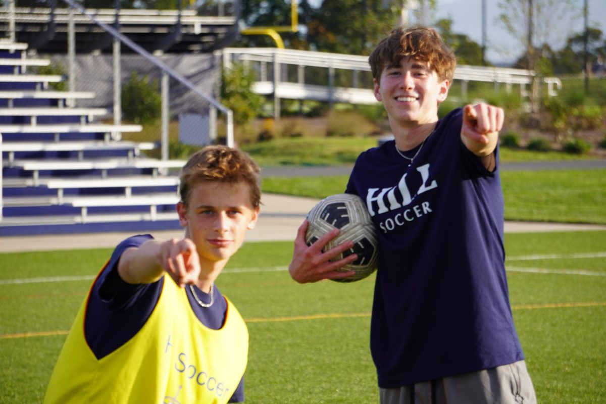 Jackson Bala 27 and Anthony Grosso 25, members of the boys varsity soccer, pose during practice. Hill soccer recently defeated South Kent School for the first time in program history.