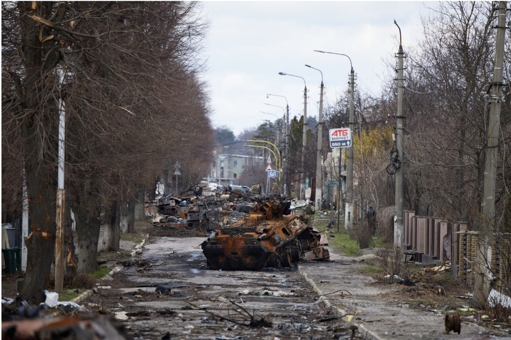 Destroyed armored vehicles block the road in Ukraine. Russia targeted Kharkiv in its recent assaults.
