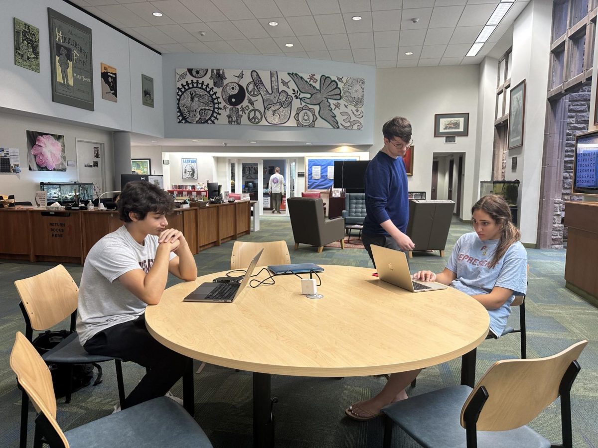 Chase Shandler '27 and Mesina Shtutman '28 work on creating content for Hill athletics during the new game management co-curricular. 